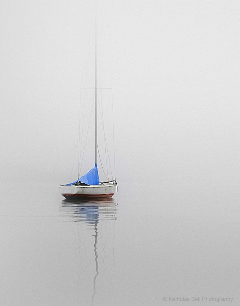 A Majestic Sailboat with Billowing White Sails A Majestic Sailboat with Billowing White Sails